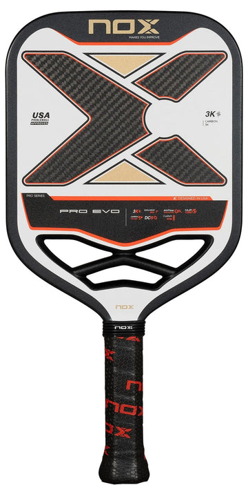The NOX Pro Evo Pickleball Paddle by NOX boasts a striking black, white, and red look with a large “X” design and textured grip. Its carbon fiber build provides serious players with superior control and spin on the court.