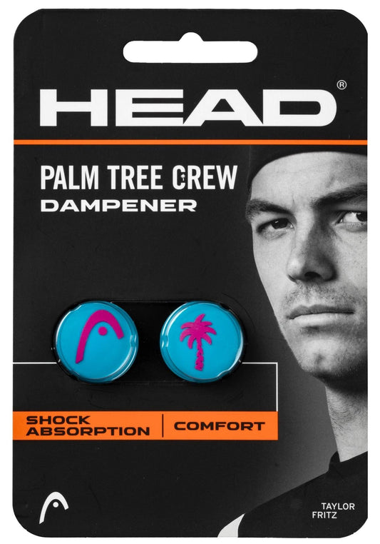 HEAD Palm Tree Crew Tennis Dampener - Blue/Pink by HEAD: Pack of two blue dampeners with pink logos, shown beside a focused male tennis player. Packaging emphasizes superior shock absorption and comfort.
