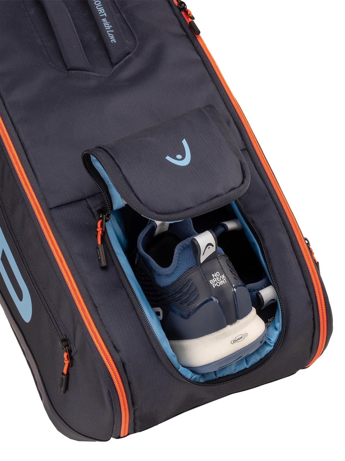 A navy HEAD Pro 9 Racket Tennis Bag L is partially open, showing blue and white athletic shoes in a dedicated compartment, highlighting the organized design typical of HEAD bags.