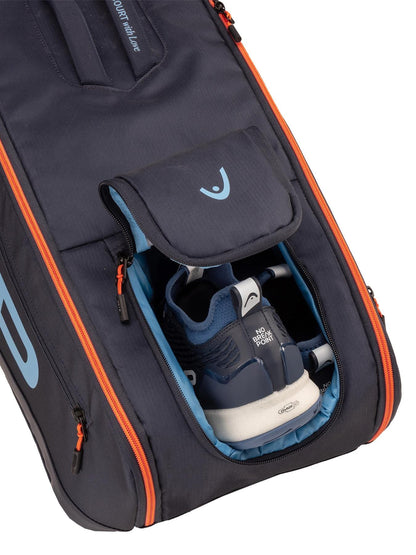 A navy HEAD Pro 9 Racket Tennis Bag L is partially open, showing blue and white athletic shoes in a dedicated compartment, highlighting the organized design typical of HEAD bags.