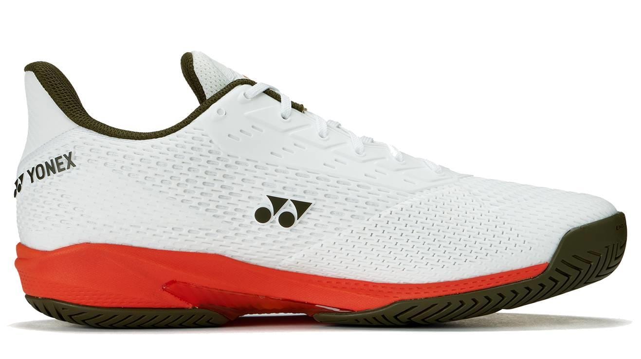 The Yonex Power Cushion Ad-Accel Men's Tennis Shoes in White/Orange feature a lightweight mesh upper, olive green logo and sole, and a bright orange midsole for speed on court—perfect for athletic performance.