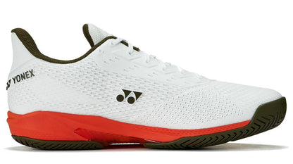 The Yonex Power Cushion Ad-Accel Men's Tennis Shoes in White/Orange feature a lightweight mesh upper, olive green logo and sole, and a bright orange midsole for speed on court—perfect for athletic performance.