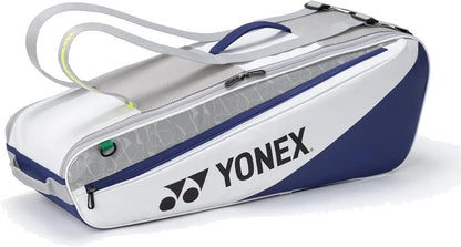 The Yonex BA52526EX Club 6 Racket Tennis Bag in white/blue features a large Yonex logo, zippered side pocket, and gray shoulder straps—ideal for carrying tennis or badminton gear.