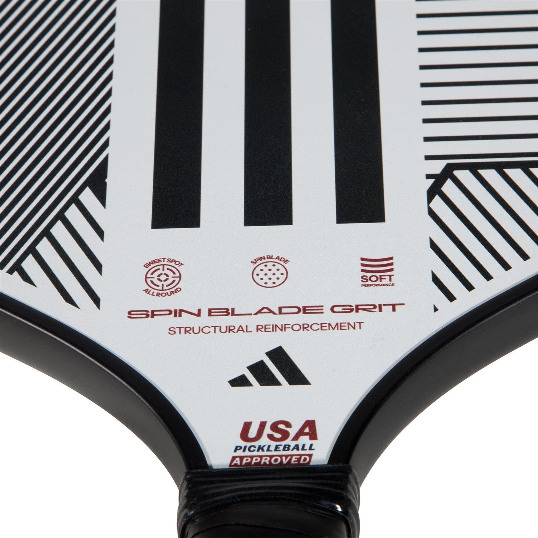 Close-up of the adidas ADIDAS Match Light 3.3 Pickleball Paddle in white with black geometric lines, "Spin Blade Grit," "Structural Reinforcement," and "USA Pickleball Approved"—ideal for beginners, featuring adidas and other logos.