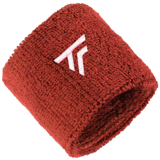 The Tecnifibre 2026 Tennis Wristband Sweatband 2 Pack in terracotta offers extended length, a white embroidered Tecnifibre logo, and is designed for comfort and extra shock absorption on court.