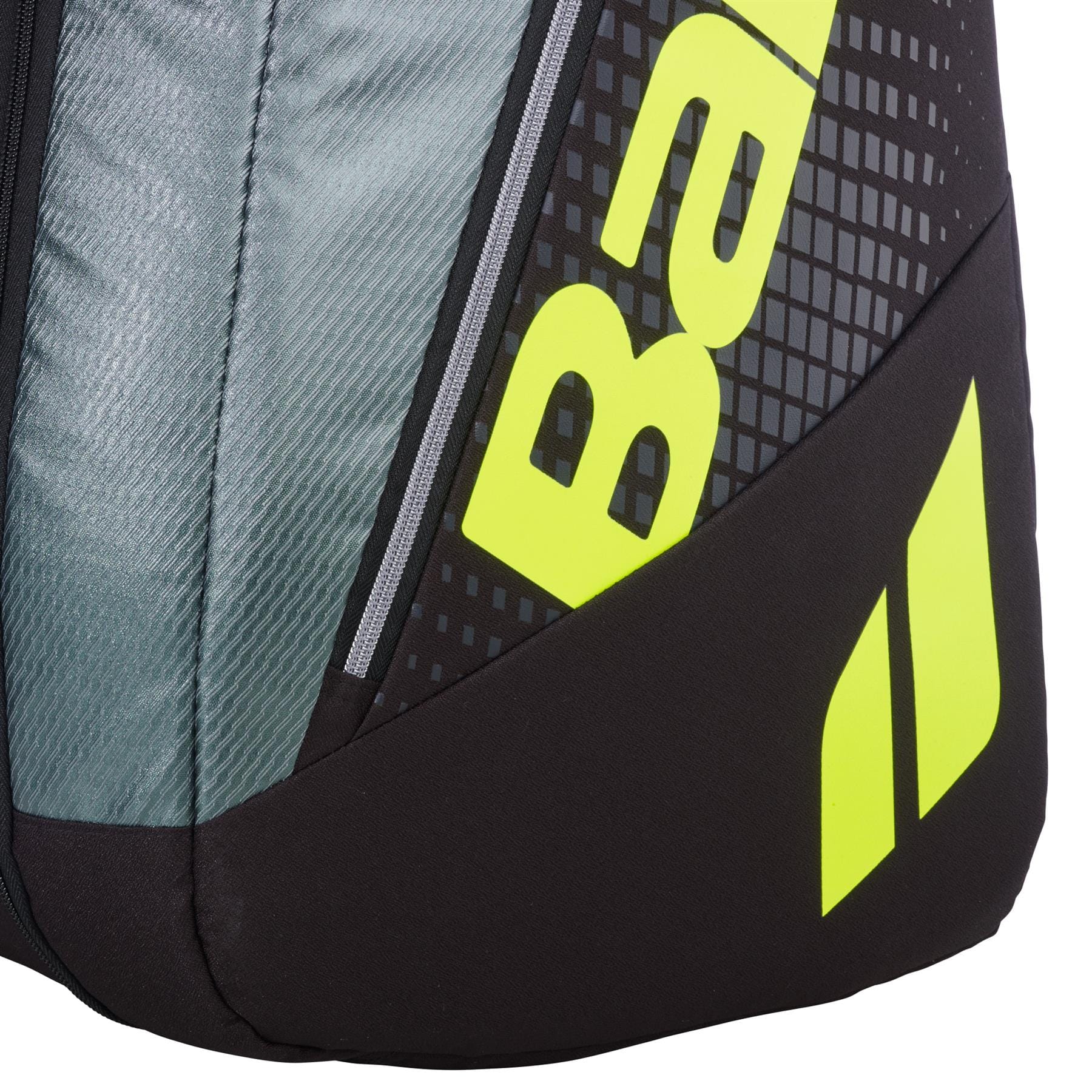 Close-up of the Babolat RH12 Pure Aero 12 Racket Tennis Bag in grey and yellow, showing black, grey, and yellow design with partial "BA" text and two yellow parallelograms on a patterned background. Brand: Babolat.