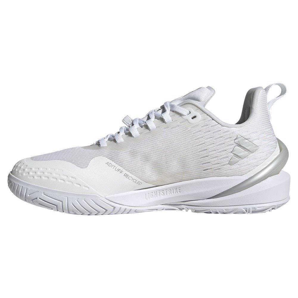 Introducing the adidas Adizero Cybersonic Women's Tennis Shoes in White/Silver: crafted for swift movements, these sneakers feature a textured sole, sleek side logo, light striping details, and a convenient pull tab at the heel. Designed with modern aesthetics and a slightly elevated heel for enhanced style.
