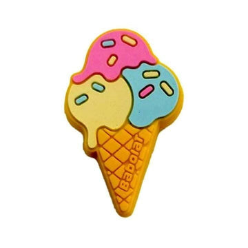 The Babolat Loony Damp Tennis Dampener - Ice Cream, by Babolat, features a colorful ice cream cone design with pink, yellow, and blue scoops and sprinkles, resembling a fun eraser, displayed against a white background.