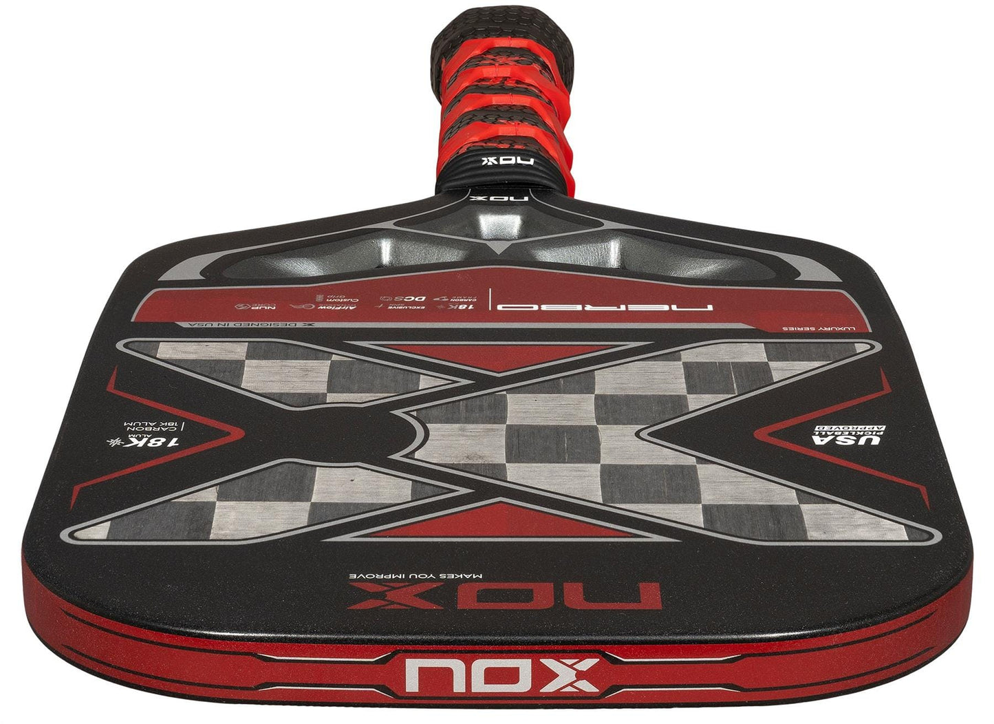 A close-up of the NOX Luxury Nerbo Pickleball Paddle by NOX, in black and red, highlighting its large “X” design, detailed graphics, aluminised carbon fibre surface, and textured grip handle.
