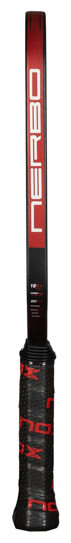 A close-up of the NOX Luxury Nerbo Pickleball Paddle handle and shaft in black and red, showcasing the bold NOX brand name. The grip features textured red and black patterns, emphasizing its aluminised carbon fibre construction.