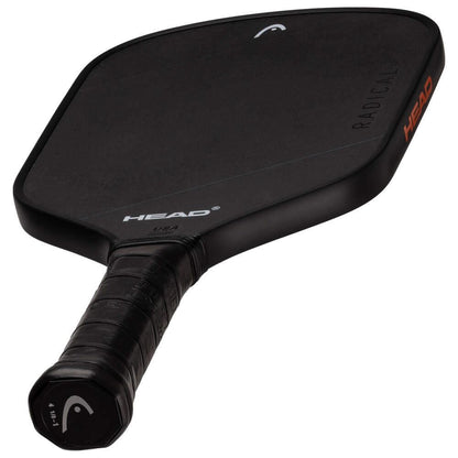 The HEAD Radical Nite Pickleball Paddle - Black is displayed against a white background, featuring a textured grip, angular edges, and SpinFusion technology. The "HEAD" brand name appears on both the paddle face and edge.