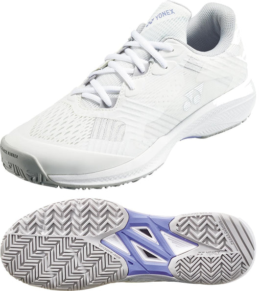 The Yonex Power Cushion Sonicage Womens Tennis Shoes in White/Grey feature mesh and synthetic details, gray and purple accents, a textured sole, and visible branding on the tongue and outsole—offering lightweight comfort ideal for tennis.
