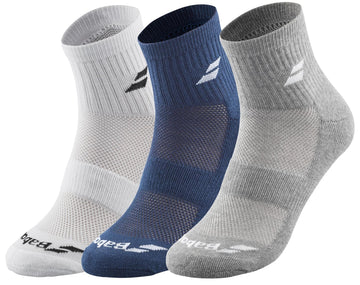 Displayed are three pairs of Babolat Quarter Tennis Socks. Available in white, blue, and gray, these socks are specifically designed for tennis with a logo near the top and ventilated zones around the foot area to enhance breathability and support.