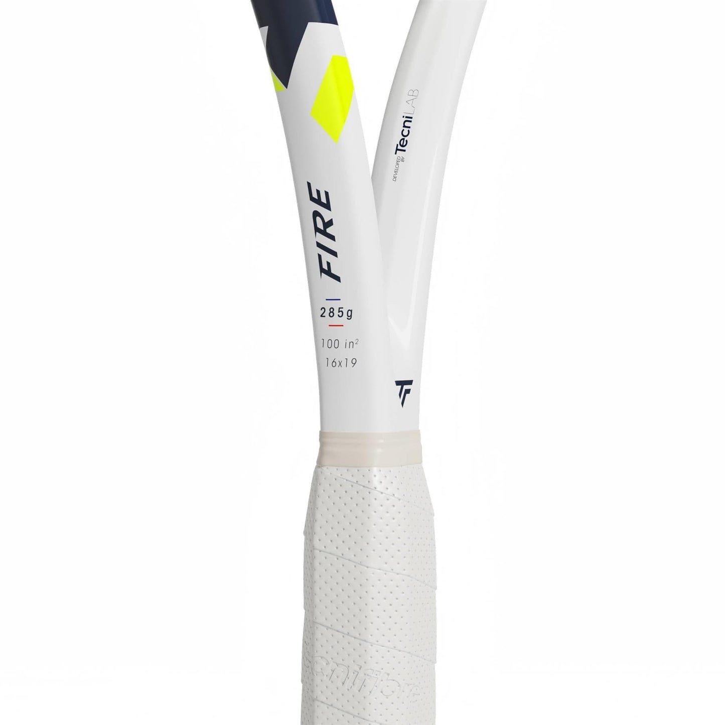 Close-up of the Tecnifibre Fire 285 Tennis Racket handle and throat, highlighting "FIRE" branding, technical specs, X-Damp vibration dampening tech, a textured grip, and geometric yellow and navy accents.