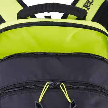 Close-up of the Babolat Kids Tennis Backpack in Metallic Grey and Fluo Yellow, featuring a black front compartment with bright yellow zipper pulls and a bold yellow top section with black straps—making it a stylish choice for young tennis players.