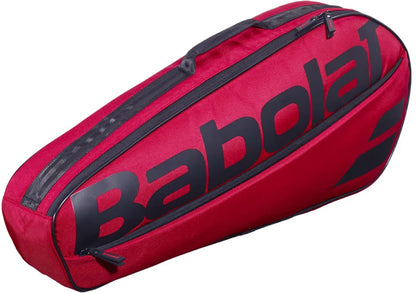 The Babolat Court XS 3 Racket Tennis Bag in Burgundy and Black combines style and functionality, featuring a zippered top compartment and a sleek, elongated design that’s ideal for carrying your tennis racquets.