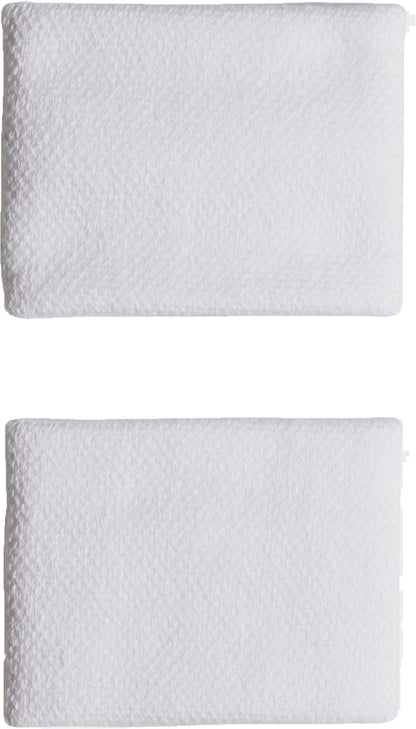 Two neatly folded white towels sit side by side on a plain white background, complemented by adidas Small Tennis Wristbands in white, made from recycled sports accessories for an added subtle, eco-friendly touch.