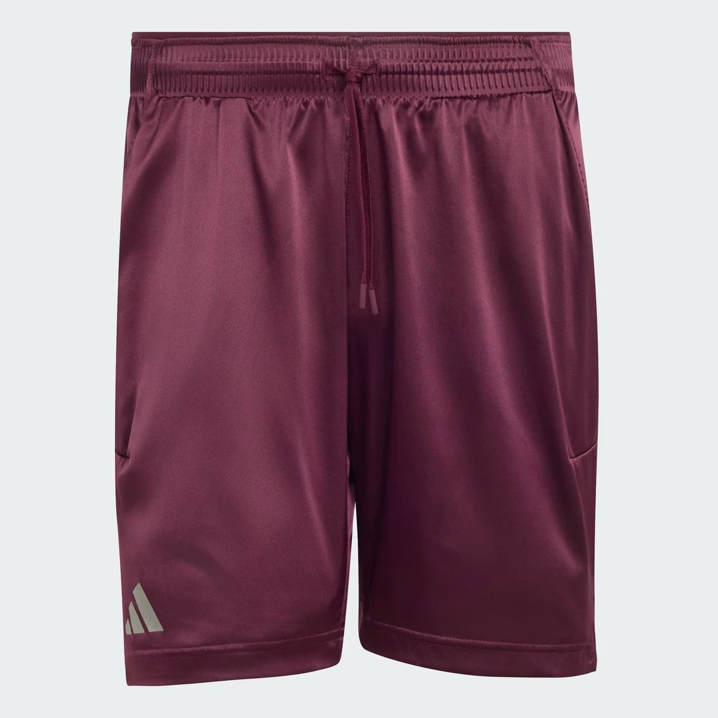 The adidas Climacool Ergo Pro Men’s Tennis Shorts in maroon feature an elastic waistband with a drawstring, side pockets, and a small adidas logo on the lower left leg.
