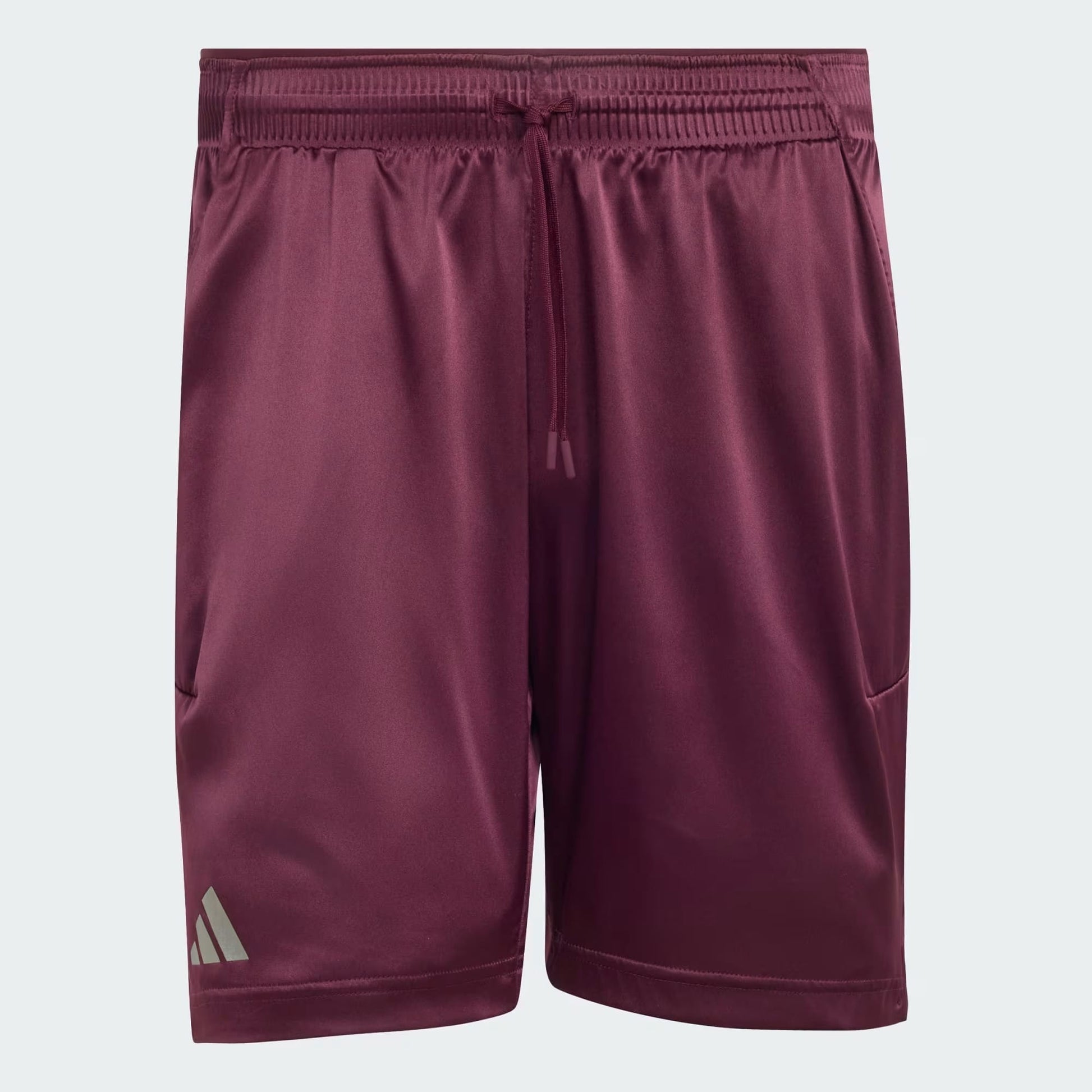 The adidas Climacool Ergo Pro Men’s Tennis Shorts in maroon feature an elastic waistband with a drawstring, side pockets, and a small adidas logo on the lower left leg.