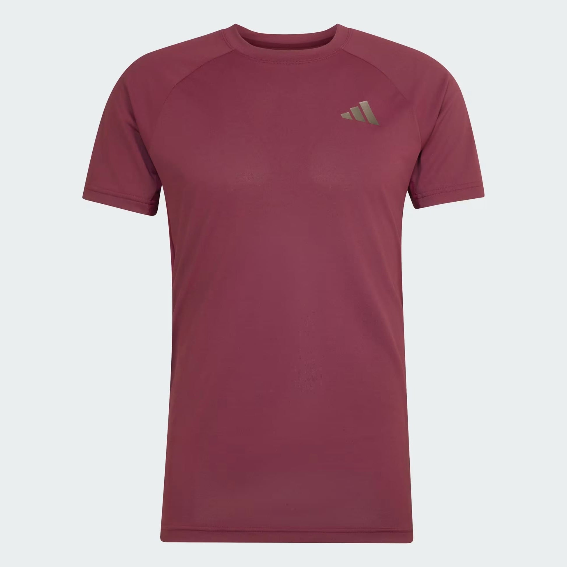 The adidas Climacool+ Freelift Pro Men’s Tennis T-Shirt in maroon features a small, light-colored adidas logo on the left chest and is shown against a light gray background.