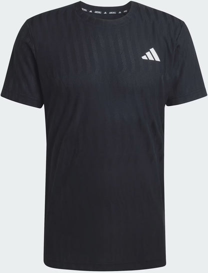 The adidas Climacool+ Airchill Freelift Men's Tennis T-Shirt in black features a white adidas logo on the left chest and subtle mesh texture for moisture-wicking breathability.
