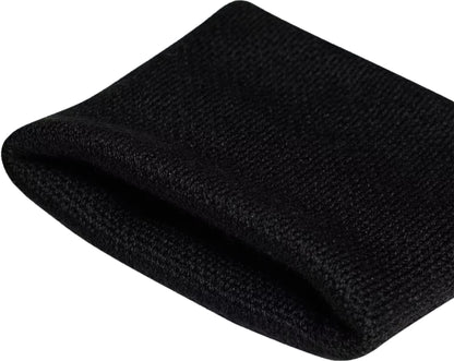A close-up of the adidas Small Tennis Wristband - Black, featuring its textured sweat-absorbent knit and open end, isolated on a white background.