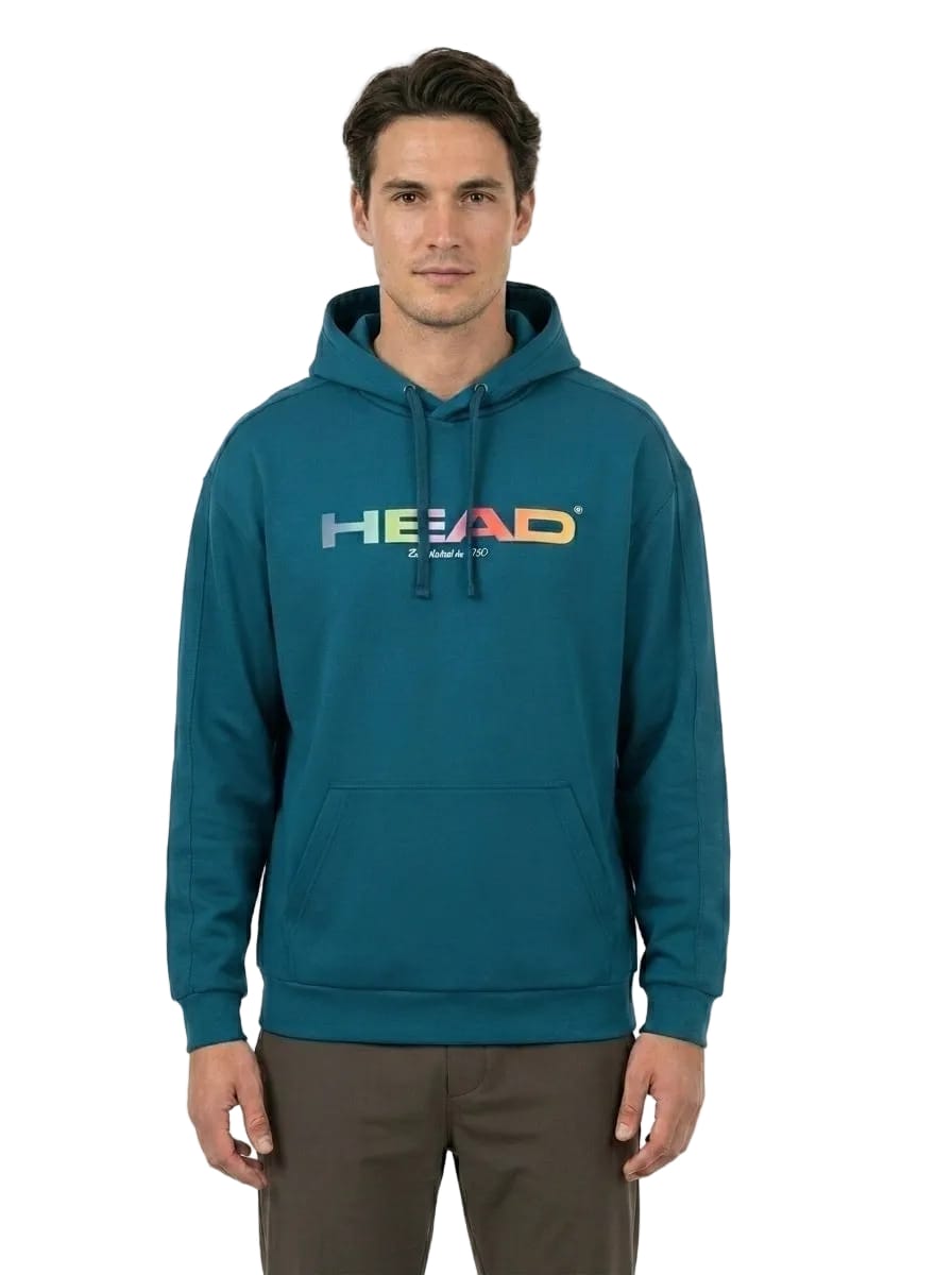 A man stands facing forward against a plain white background, wearing the HEAD Rally Men’s Tennis Hoodie in teal by HEAD, crafted from soft French terry and featuring a rainbow-colored “HEAD” logo on the front.