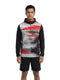 A man stands facing forward in a HEAD Vision Topspin Mens Tennis Hoodie - BKXV by HEAD—a black and gray long-sleeve men’s sports hoodie with red stripes—paired with black shorts, set against a plain white background.