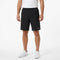 A person wearing a white shirt, HEAD Club Bermudas Men’s Tennis Shorts in black, and white sneakers stands against a plain white background.
