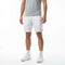 A person wears white HEAD Performance Mens Tennis Shorts with a logo on the left leg, paired with a gray t-shirt, white socks, and white sneakers.