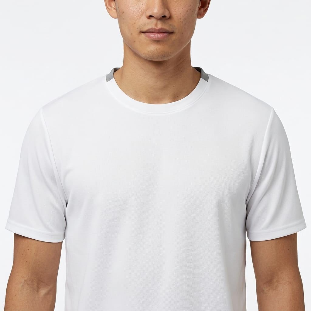 A person is shown from the shoulders to the chest wearing the HEAD Simple Men’s Tennis T-Shirt in white, against a white background. The individual’s face is partially visible, displaying no distinct expression.