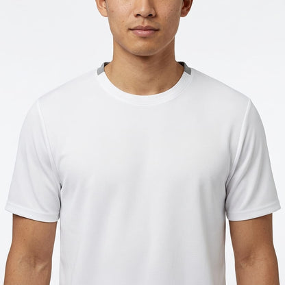 A person is shown from the shoulders to the chest wearing the HEAD Simple Men’s Tennis T-Shirt in white, against a white background. The individual’s face is partially visible, displaying no distinct expression.