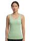 A woman with tied-back hair wears the HEAD Spirit II Women’s Tennis Tank Top in Celeste, featuring advanced cooling technology, and stands facing forward against a white background.