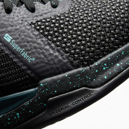 Close-up of HEAD Sprint Pro 4.0 SF Men's Tennis Shoes in Black/Teal, featuring textured mesh, speckled teal midsole, and visible SuperFabric® and Lateral Control branding for enhanced durability and performance.