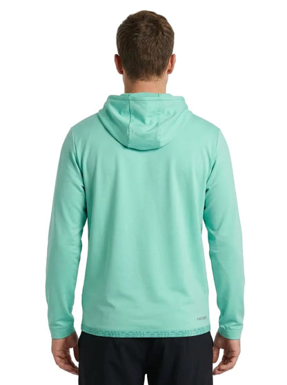 A man wearing a light turquoise HEAD Topspin Mens Tennis Hoodie - TQXU and black pants is standing with his back to the camera against a white background. This HEAD hoodie combines style and comfort, making it ideal for active days.