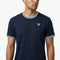 A man wearing the Tecnifibre Team Stretch Men’s Tennis T-Shirt in Marine Blue, a performance shirt featuring white trim on the collar and sleeves and a small white Tecnifibre logo on the left chest, stands against a plain white background.