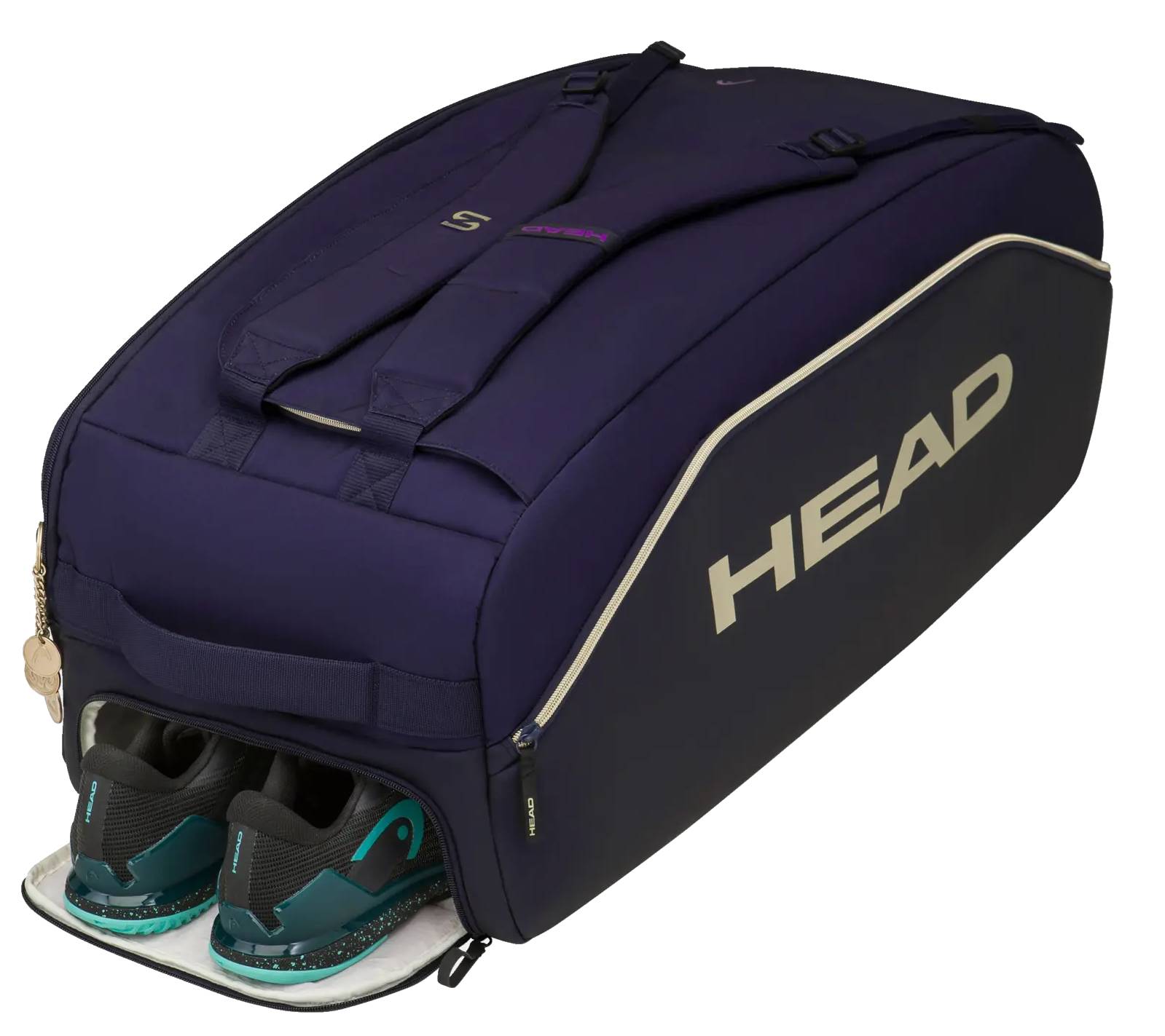 A large HEAD Pro X Zverev LTD Tennis Duffle Bag L - Navy from HEAD sits with its zippered shoe compartment open, revealing a pair of teal and black athletic shoes inside. Inspired by Alexander Zverev, this tennis duffle bag features padded straps and stylish white trim for comfort and flair.