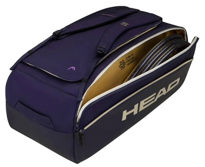A navy HEAD Pro X Zverev LTD Tennis Duffle Bag L by HEAD with a side zipper open, revealing several tennis rackets inside. Inspired by Alexander Zverev, this duffle bag features comfortable shoulder straps and a bold “HEAD” logo displayed on the side.