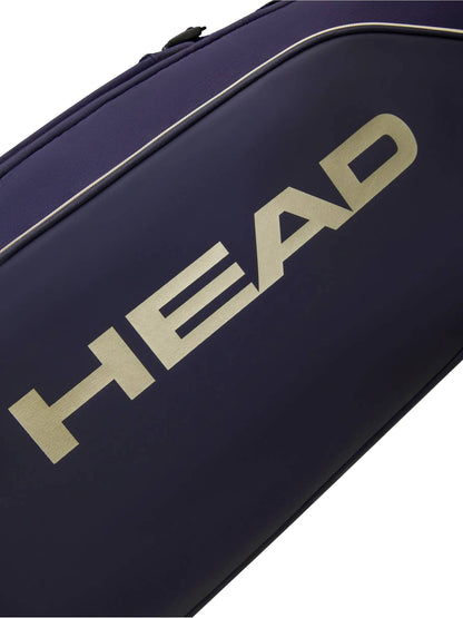 Close-up of the HEAD Pro X Zverev LTD Tennis Duffle Bag L in navy, featuring the brand’s name “HEAD” in large, bold, metallic gold lettering down the side—a stylish homage to Alexander Zverev’s signature collection.