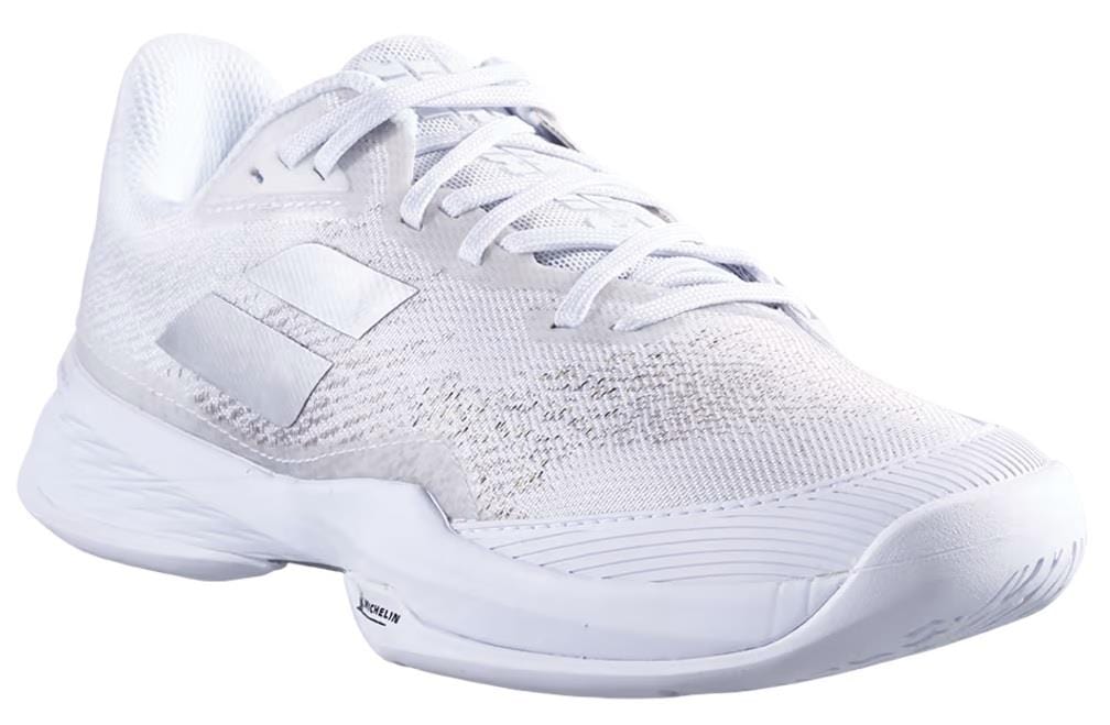 Introducing the Babolat Jet Mach 3 All Court Men's Tennis Shoes in White/Silver—an athletic tennis shoe featuring a mesh upper, white laces, and a white sole with textured detailing. Subtle design accents adorn the sides, while enhanced shock absorption ensures comfort during play.