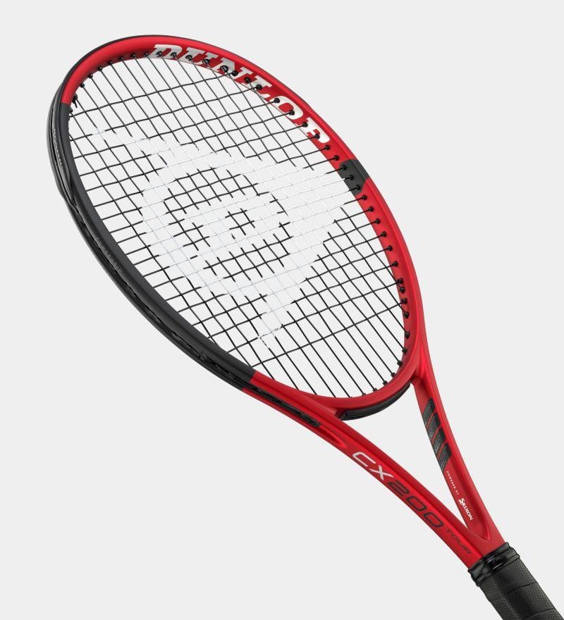 The Dunlop CX200 Tour 16x19 310g Tennis Racket showcases a red and black design, with the Dunlop brand name prominently displayed on its sleek, aerodynamic frame. It features a compact racket head with an open 16x19 stringing pattern, and the model "CX200 Tour" is clearly marked on the lower part of the frame.