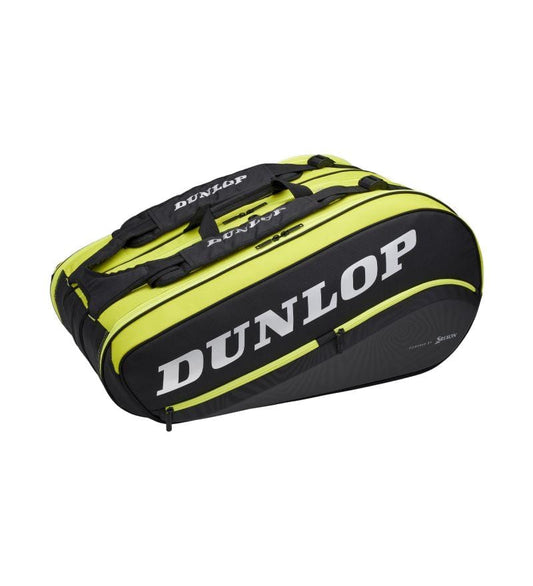 The Dunlop SX-Performance 12 Racket Thermo Tennis Bag, presented in bold black and yellow, includes dual handles and a prominent logo. It's crafted to accommodate numerous rackets and accessories while featuring thermo insulation to safeguard your gear.