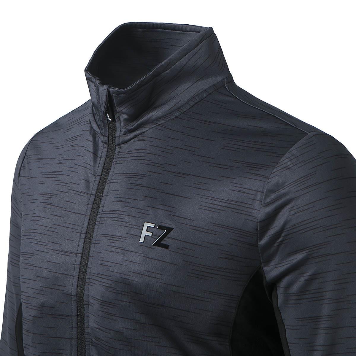 A close-up of the FZ Forza Savoy Women's Jacket - Black reveals a subtle textured pattern on its black zip-up design. This stretchable piece from FZ Forza features a high collar and the initials "FZ" in black on the chest, enhanced by its Dryforze technology for optimal comfort.