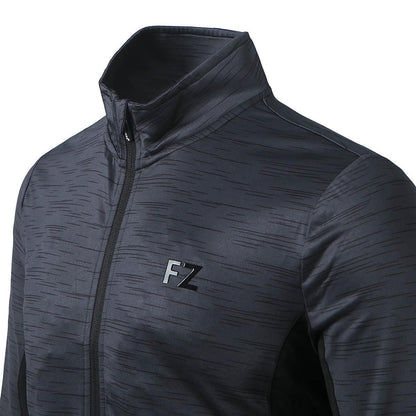 A close-up of the FZ Forza Savoy Women's Jacket - Black reveals a subtle textured pattern on its black zip-up design. This stretchable piece from FZ Forza features a high collar and the initials "FZ" in black on the chest, enhanced by its Dryforze technology for optimal comfort.