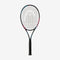 A HEAD MX Spark Pro Tennis Racket - Black features a striking design on its frame set against a plain white backdrop. Perfect for beginners, the racket's strings are arranged in a precise grid pattern, and its grip is wrapped in dark material.