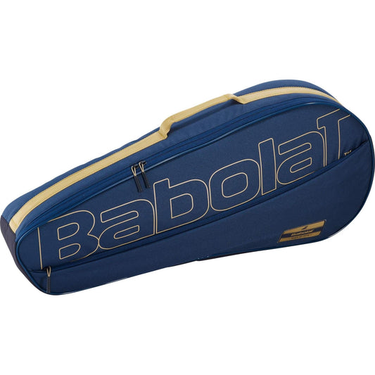 A dark blue and beige Babolat RH3 Essential 3 Racket Tennis Bag, equipped with a zipper and handle, prominently displaying the Babolat logo in large letters across the side.