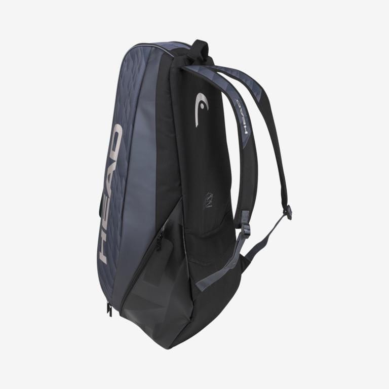The HEAD Djokovic 6R Combi 6 Racket Tennis Bag, available in black and grey, prominently displays the brand name "HEAD." It includes multiple zippered compartments and adjustable shoulder straps, along with CCT+ climate control technology to safeguard your sports equipment.