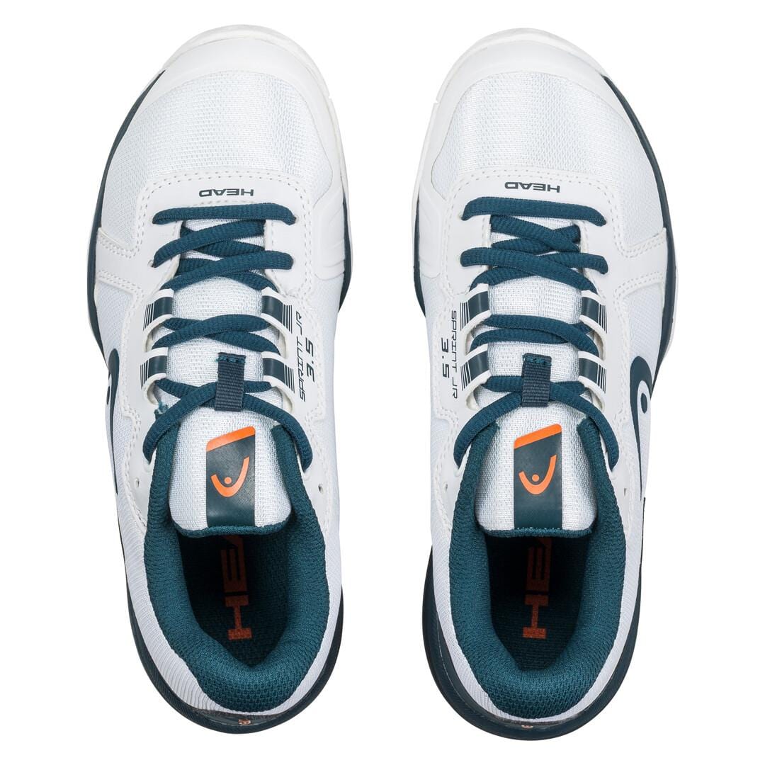 Product Description: The HEAD Sprint 3.5 Junior Tennis Shoes in white and orange offer a top-down view showcasing their stylish design. Featuring a dark green tongue and laces complemented by a small orange logo on the tongue, these lightweight shoes deliver a sleek, modern aesthetic with breathable mesh construction, ideal for sports activities.