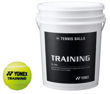 A bucket labeled "Yonex Training Tennis Balls," designed for consistent bounce during training sessions, sits next to a yellow Yonex training tennis ball.
