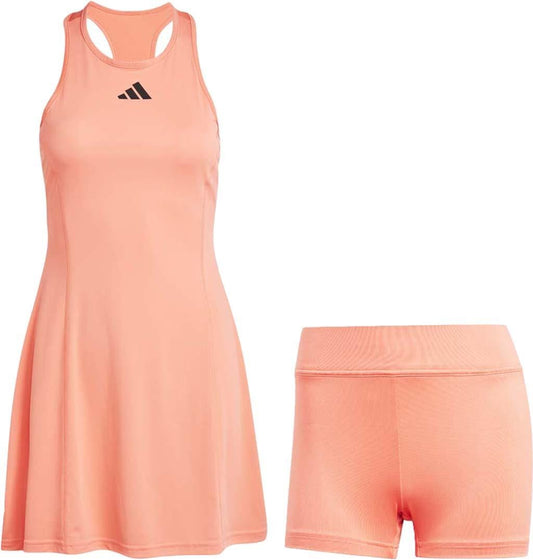 Introducing the adidas Women's Club Tennis Dress in Coral, a stylish piece featuring a racerback design and highlighted by a black logo on the chest. Designed with AEROREADY technology for superior comfort, this dress includes matching shorts for an optimal performance fit.